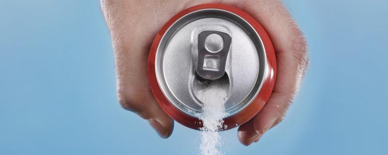 Sugar being poured from a soda can