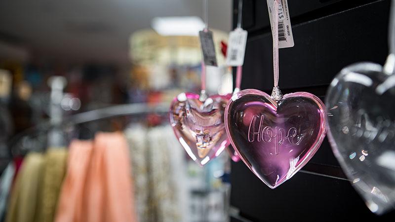 heart shaped necklace with the word "hope" written on it