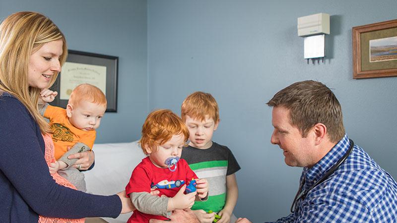 SPH family medicine doctor with mom and her three kids