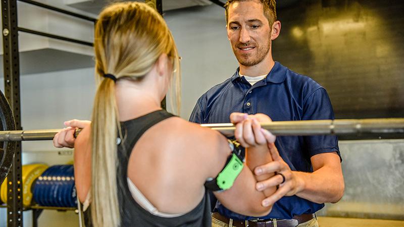 Physical therapist working with patient